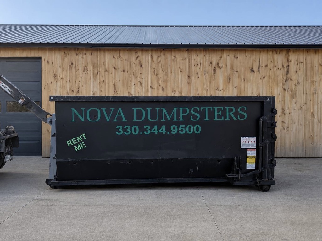 Nova Dumpsters roll-off bin placed cleanly on a concrete pad